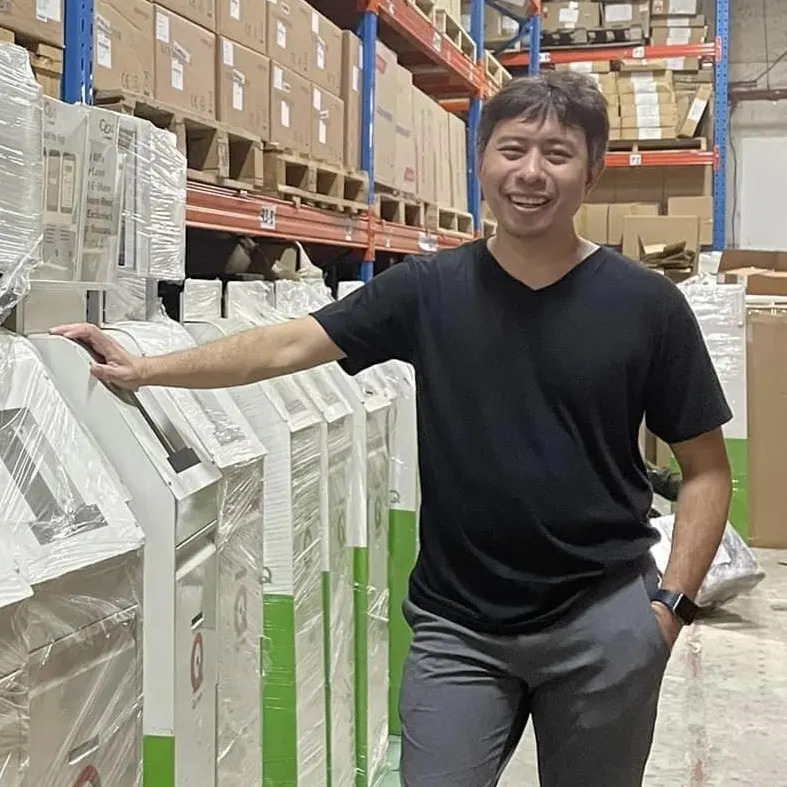 Kernan Motoomull with wrapped 7-Eleven kiosks in a warehouse